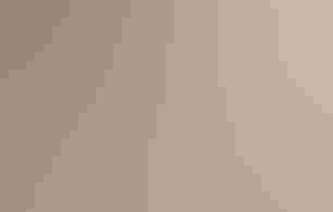 A person's hands sort through small bones and bits of fur with a toothpick on a white surface.